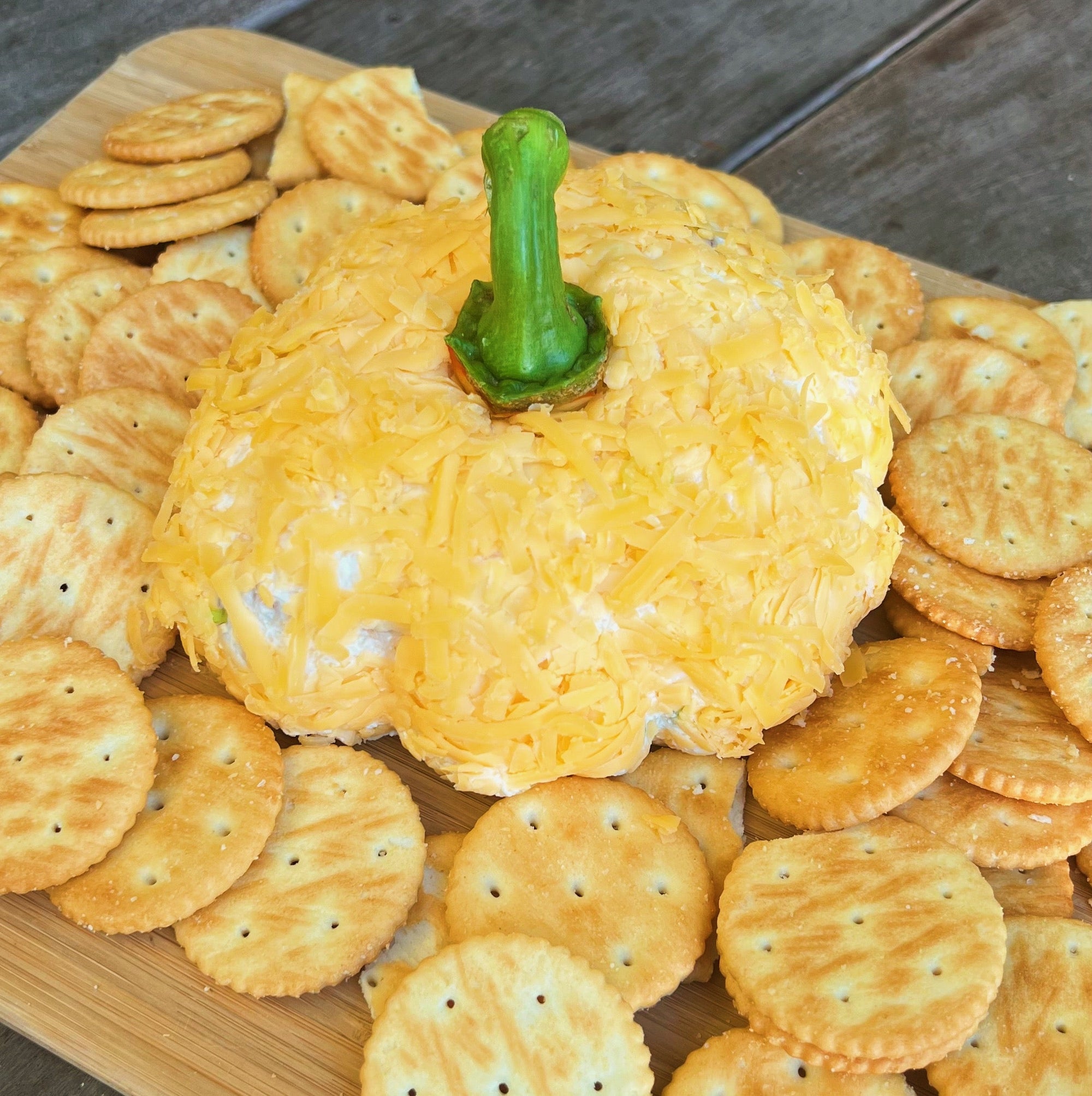 a pumpkin shaped cheese ball with Dungeness crab