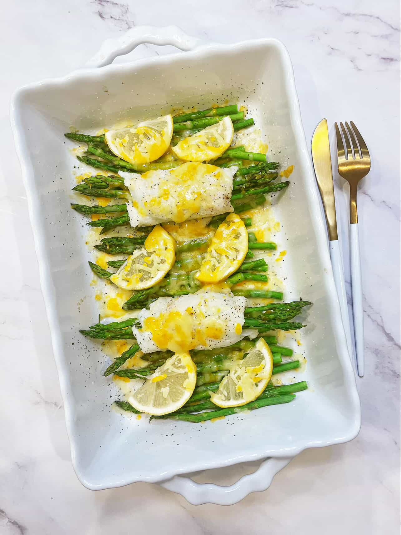 delicious plate of asparagus stuffed halibut with fresh lemon