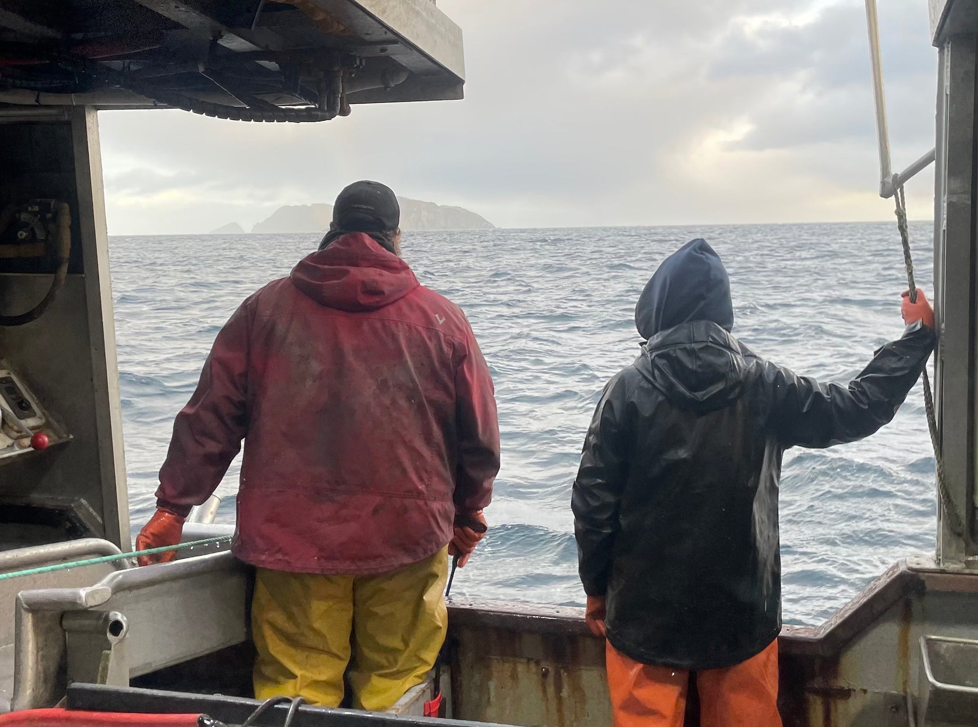 husband and wife fishermen at sea in alaska