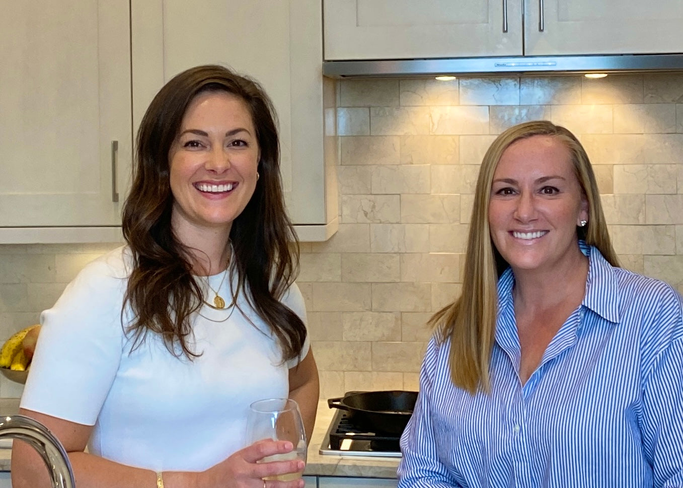 Ashley and Joci Besecker, female founders of the woman-owned business, Premier Catch, standing in the kitchen