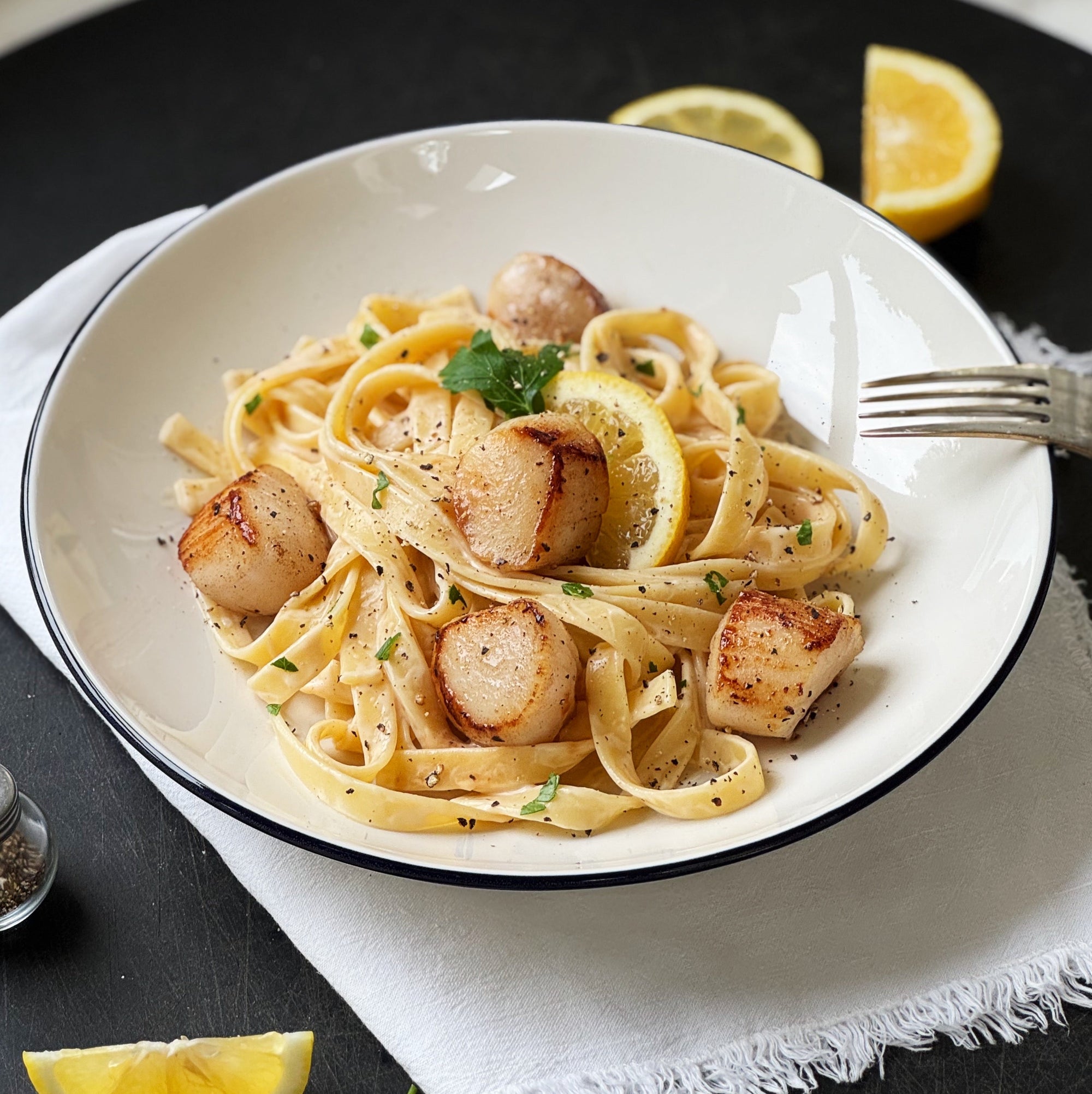 delicious scallop alfredo pasta in bowl