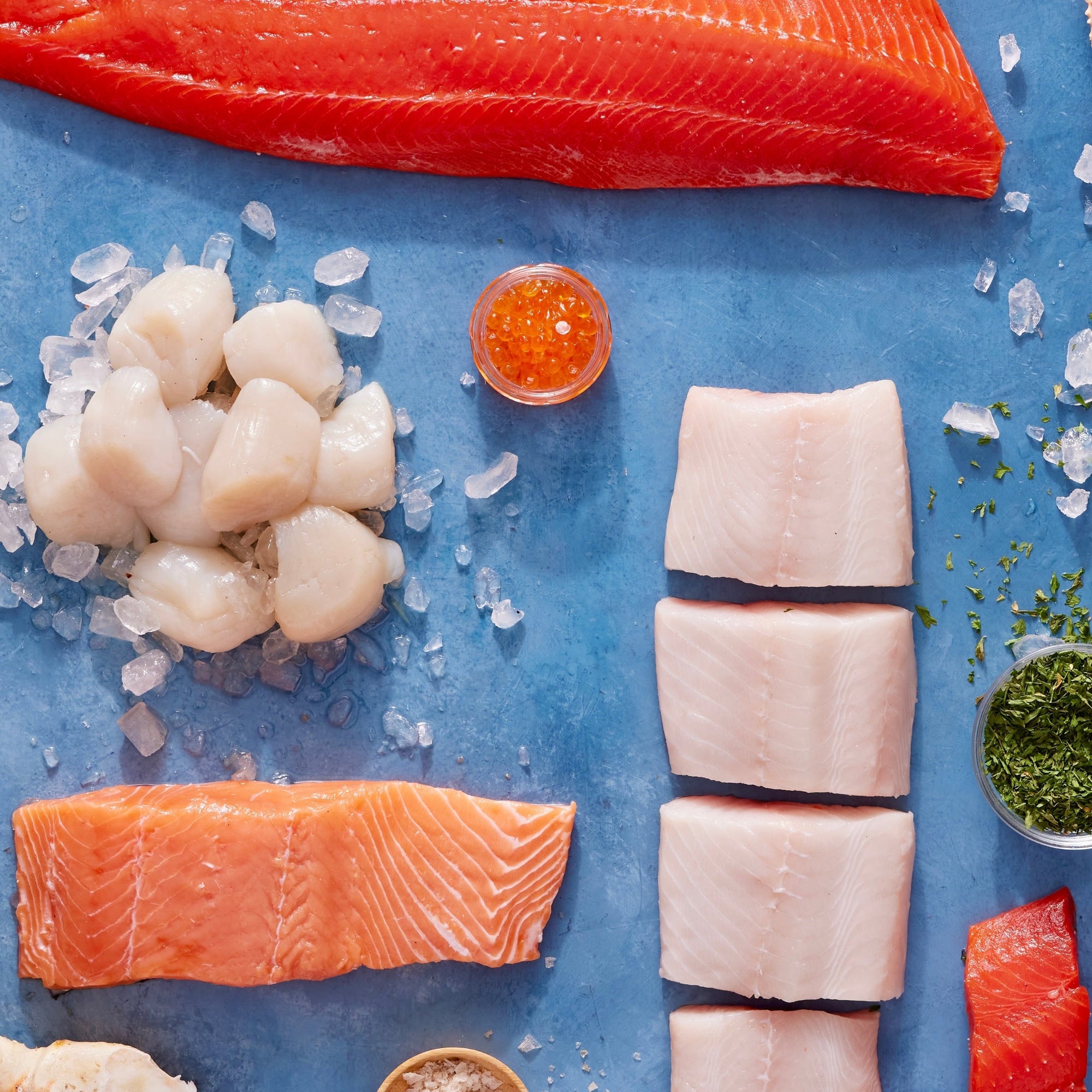 wild seafood arranged on a blue platter