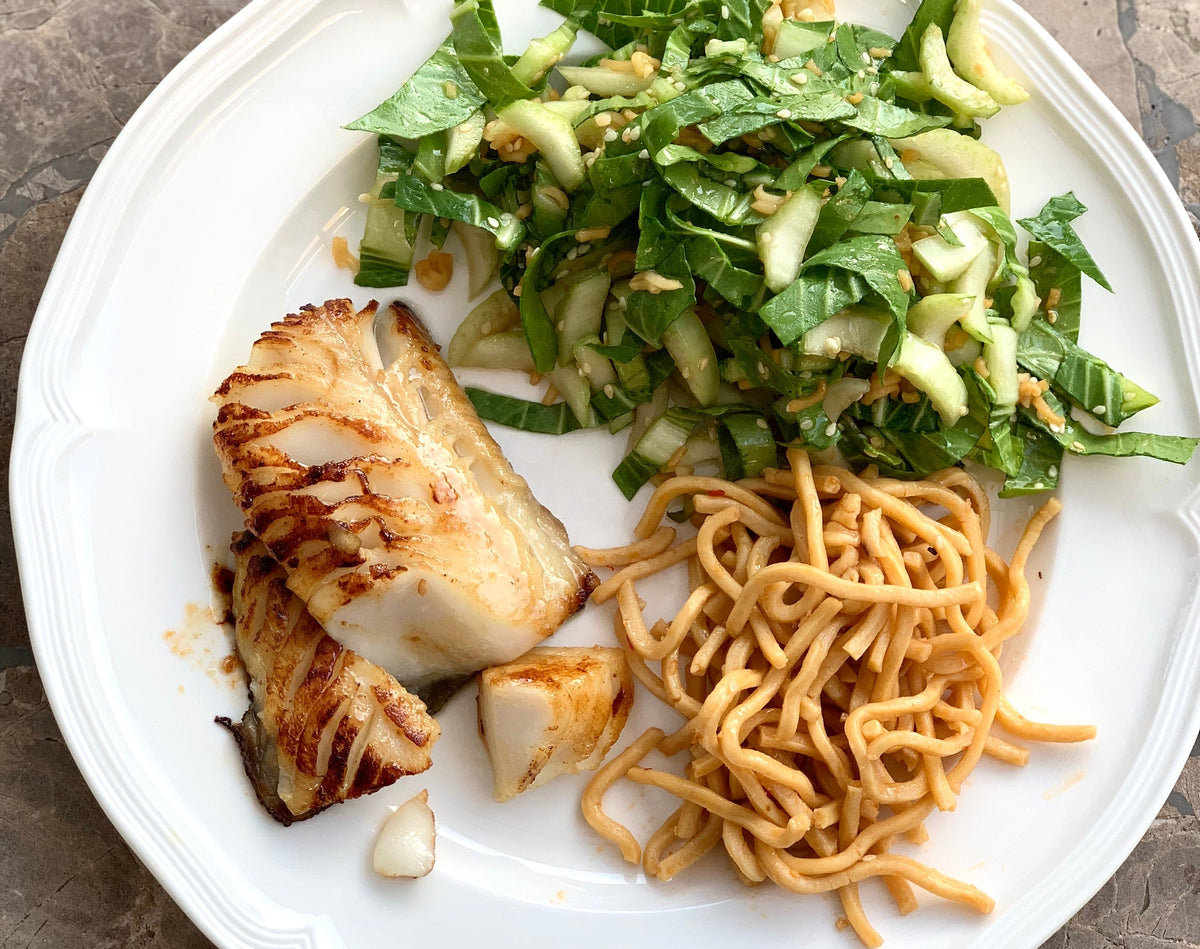 Seared black cod with chow mein noodles and a chopped cucumber salad