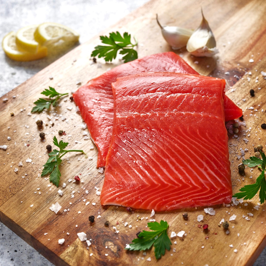 two pieces of sockeye salmon with herbs