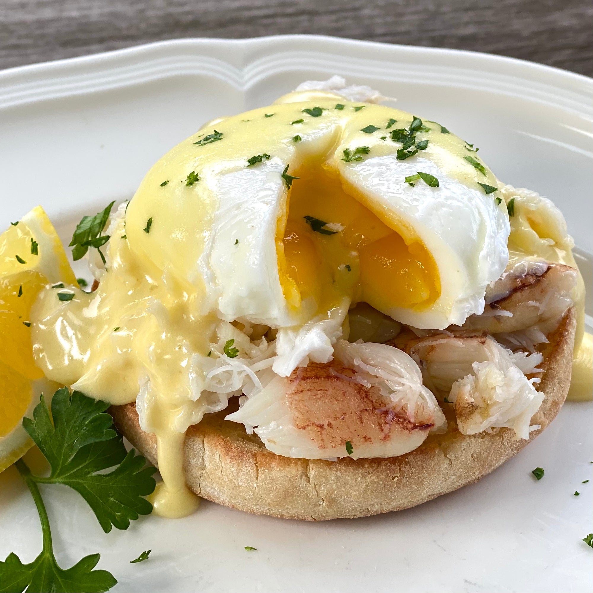 Dungeness crab eggs benedict with hollandaise on an English muffin