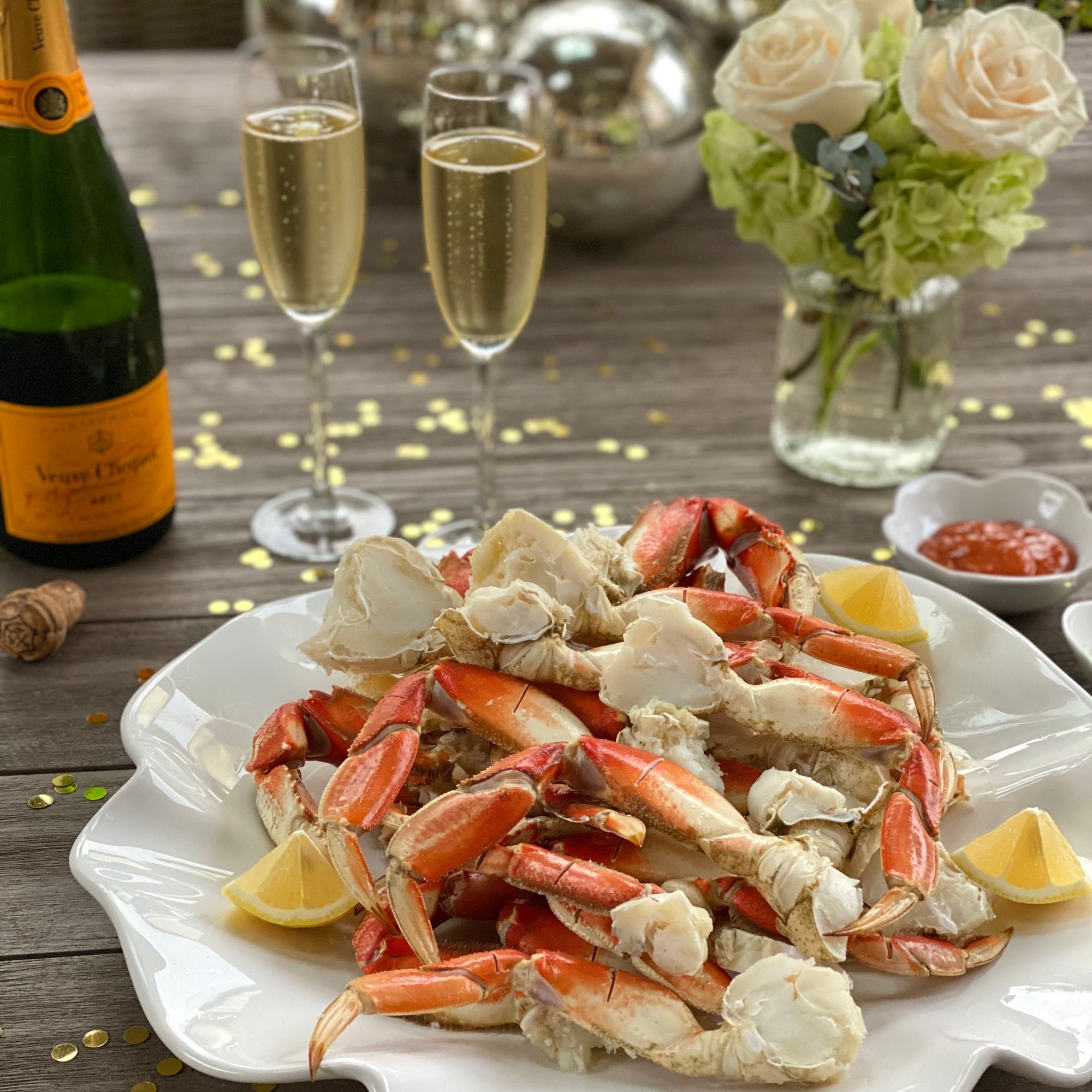 beautiful tablescape with dungeness crab legs and champagne
