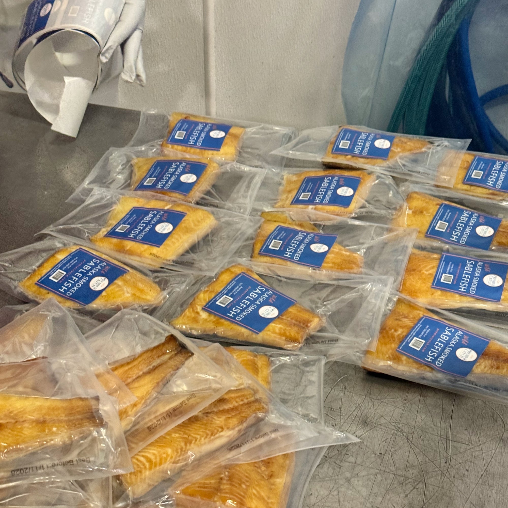 Vacuum sealed wild Alaska smoked sablefish portions during packaging process