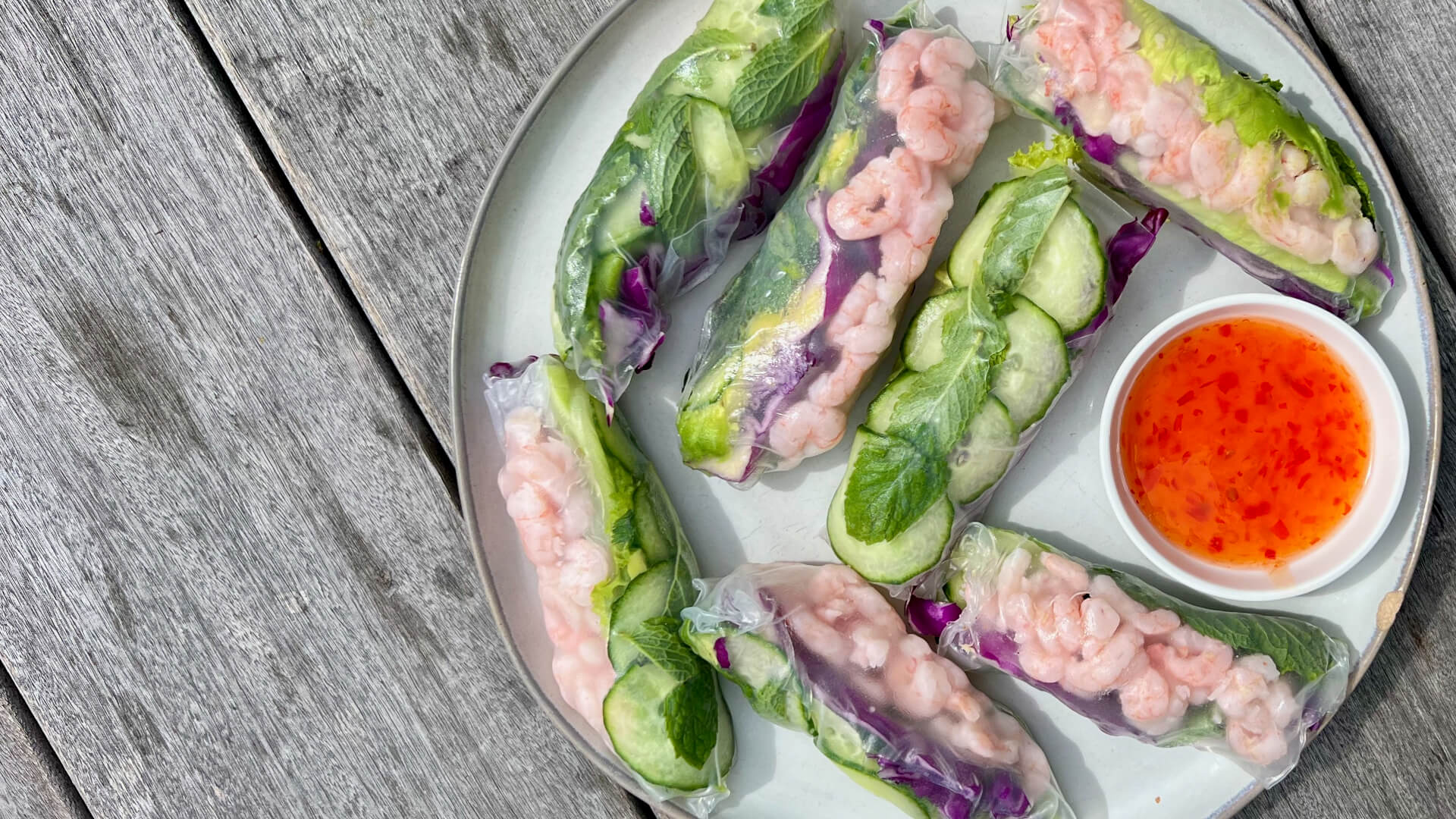 Bay shrimp spring rolls made with cucumbers and other vegetables from a Premier Catch seafood recipes cookbook