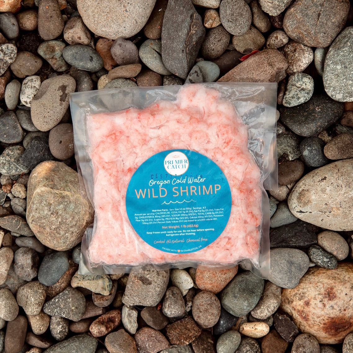 Wild Oregon shrimp in package on top of rocks